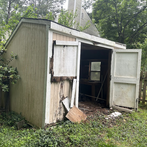 Old mower and outdoor debris waiting for removal
